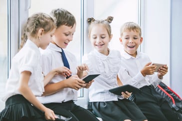 group of private school students sitting together