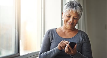 woman using mobile phone to donate to a nonprofit